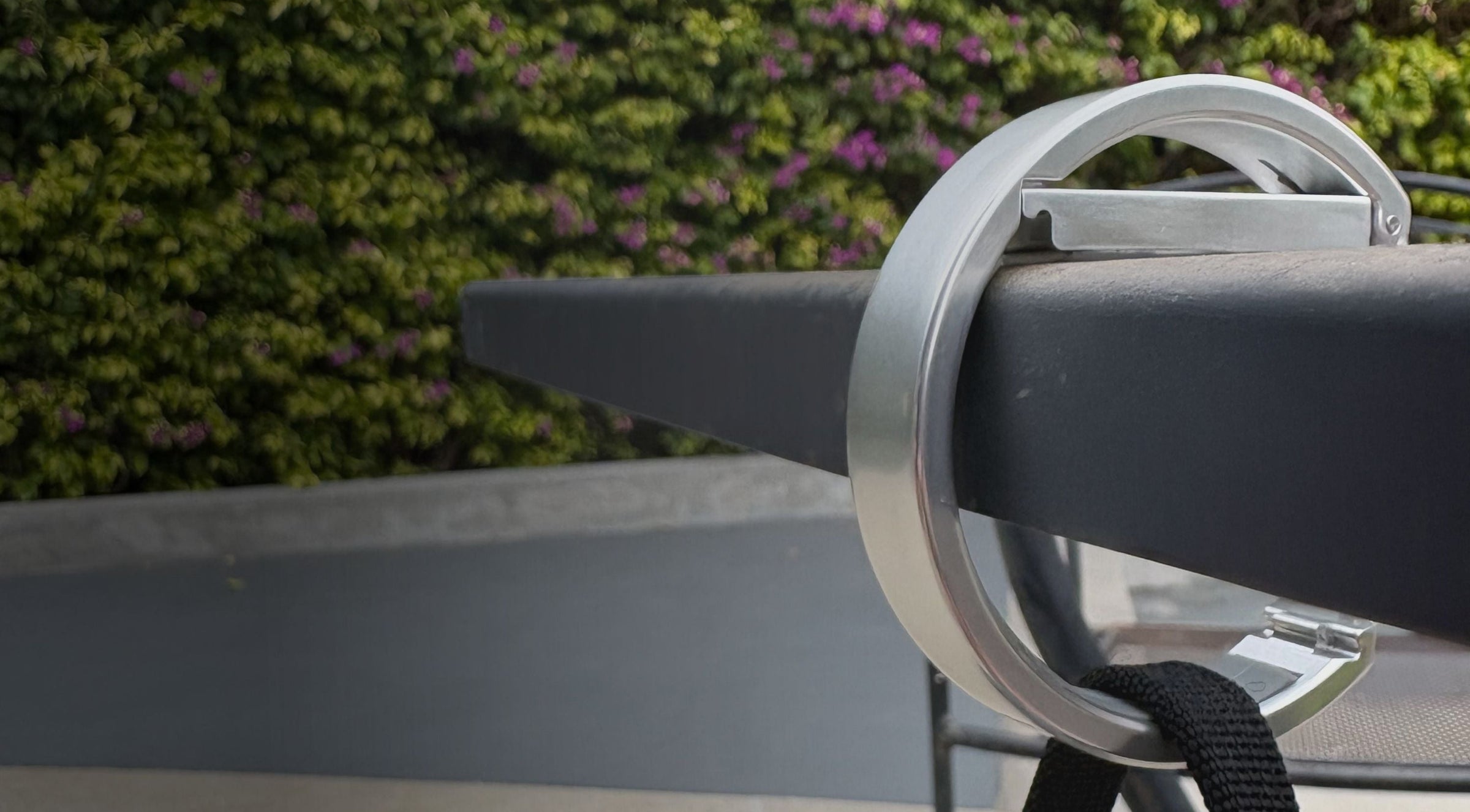 Clingy hook holding a bag off the floor on a table.